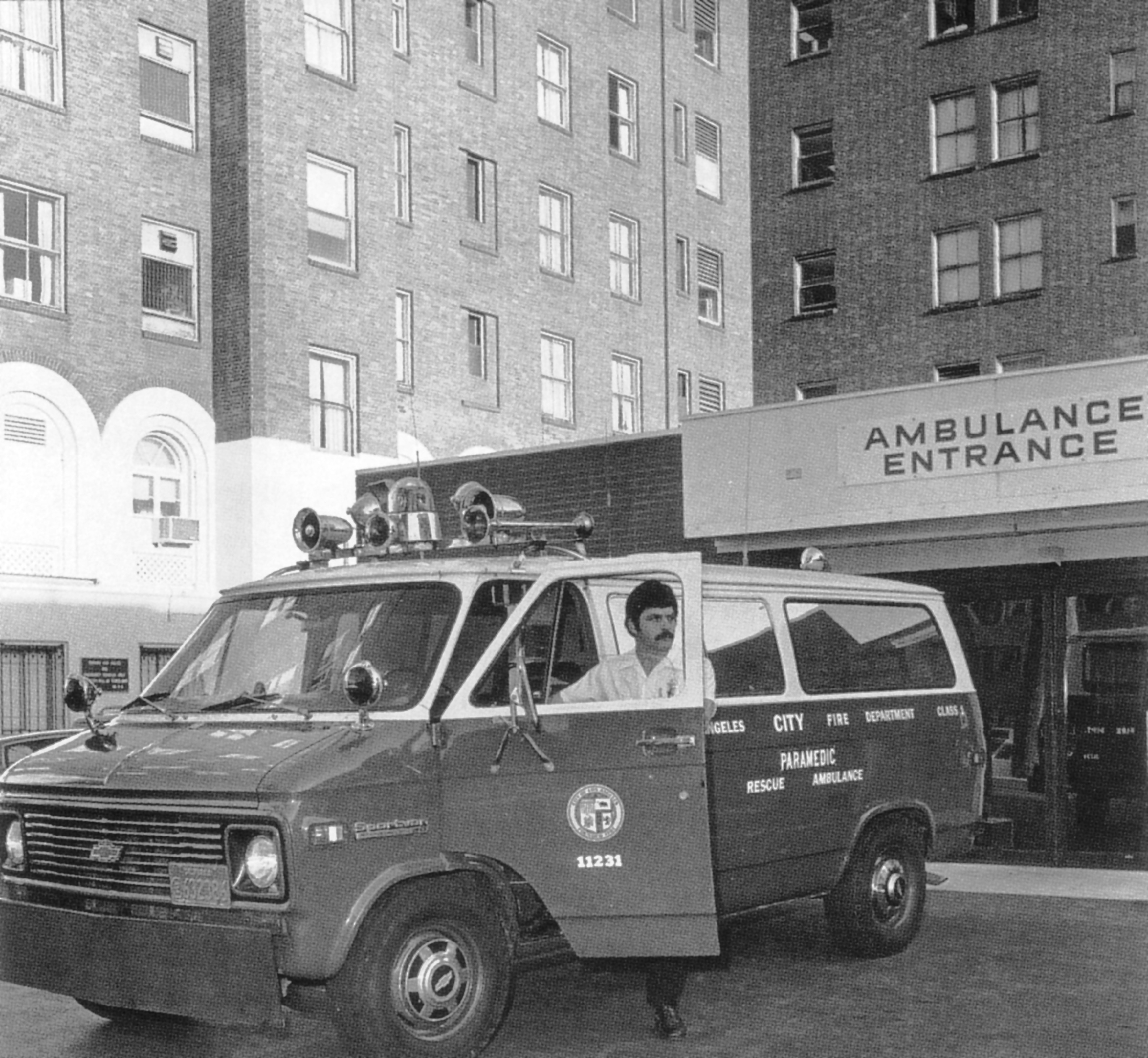 1960s paramedic standing in front of the Emergency Department