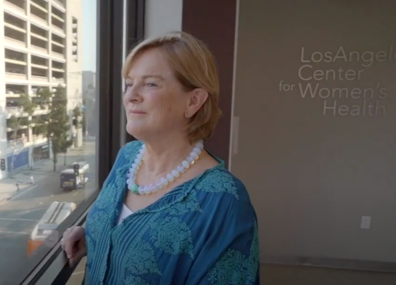 Kathleen Maguire standing in the lobby of the Los Angeles Center for Women's Health at CHMC