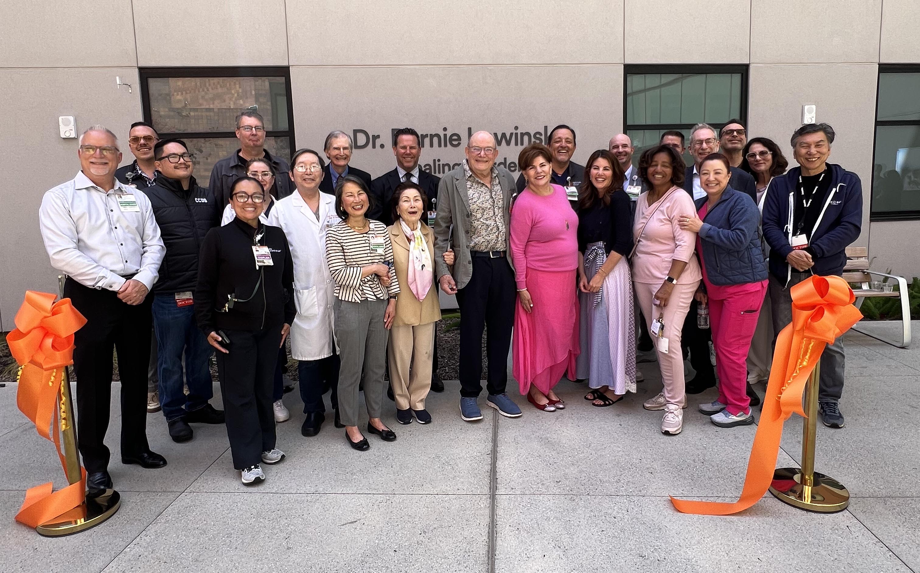 Dr. Bernie Lewinsky center with his family alongside California Hospital staff