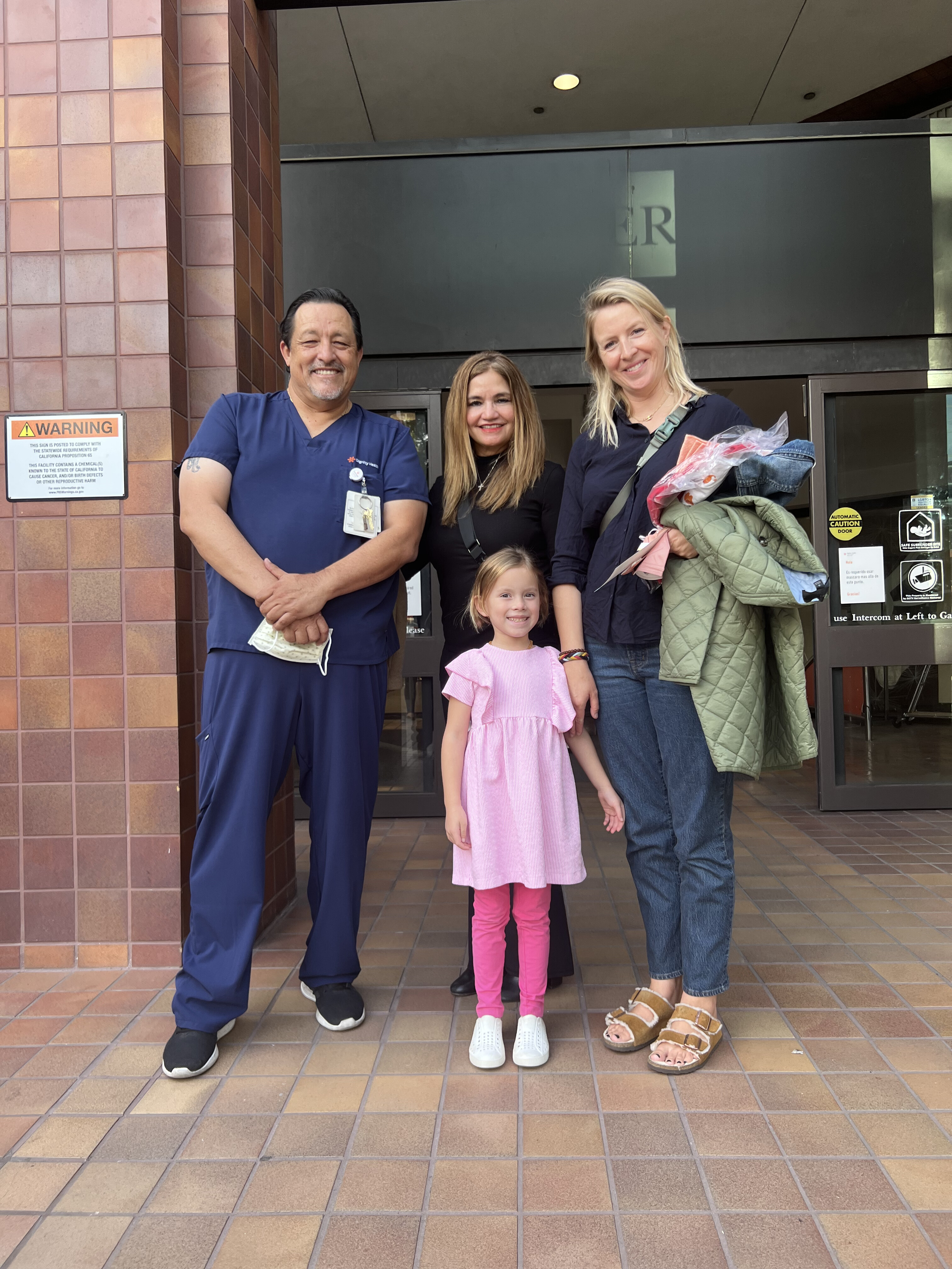 NICU Director Tony Marcelli, MSN, RN, Glenda Minjares, RN, Mallory and Joanna Nagata standing in from of the main entrance to California Hospital