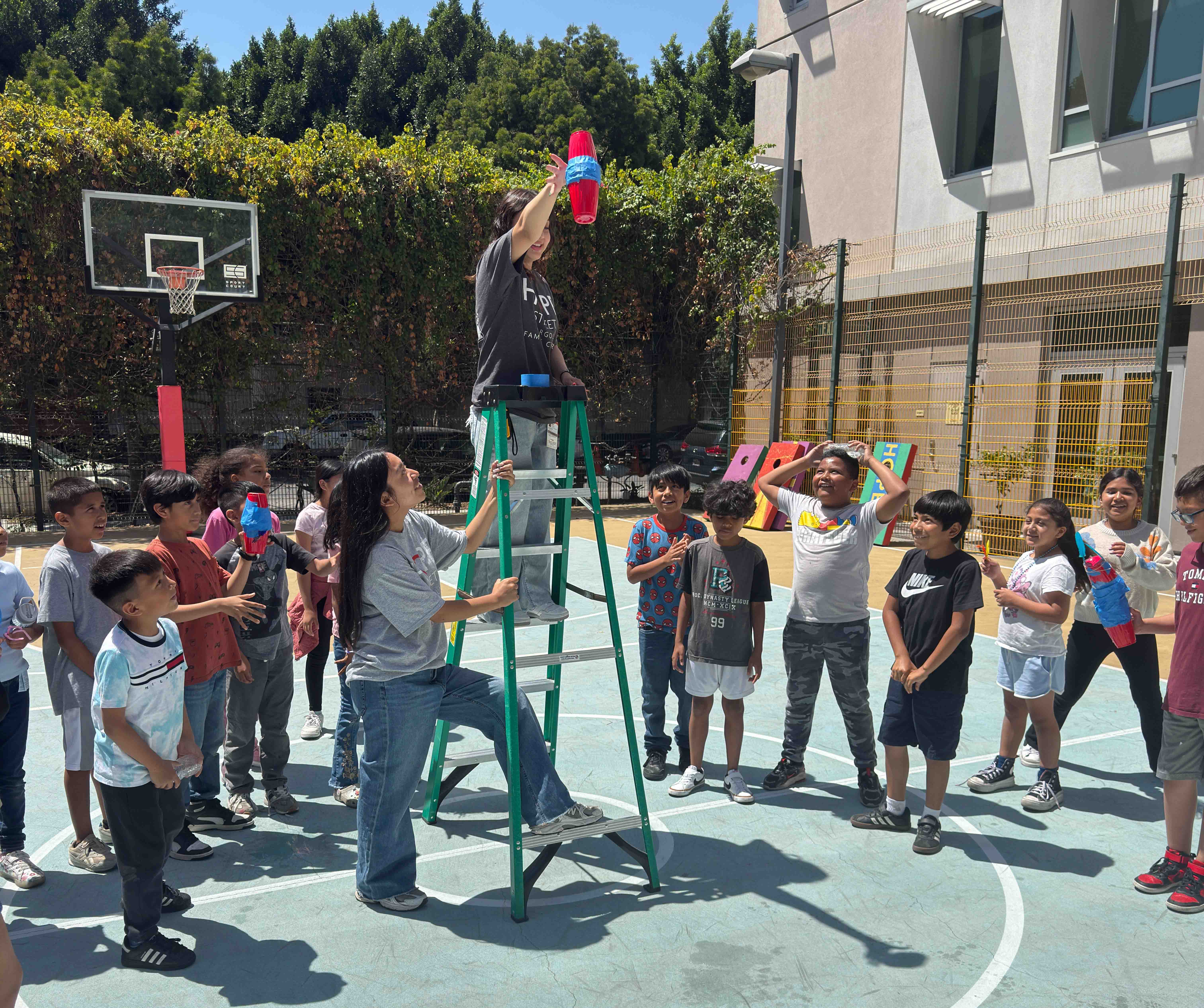 Summer of Science students participating in the balloon drop experiment