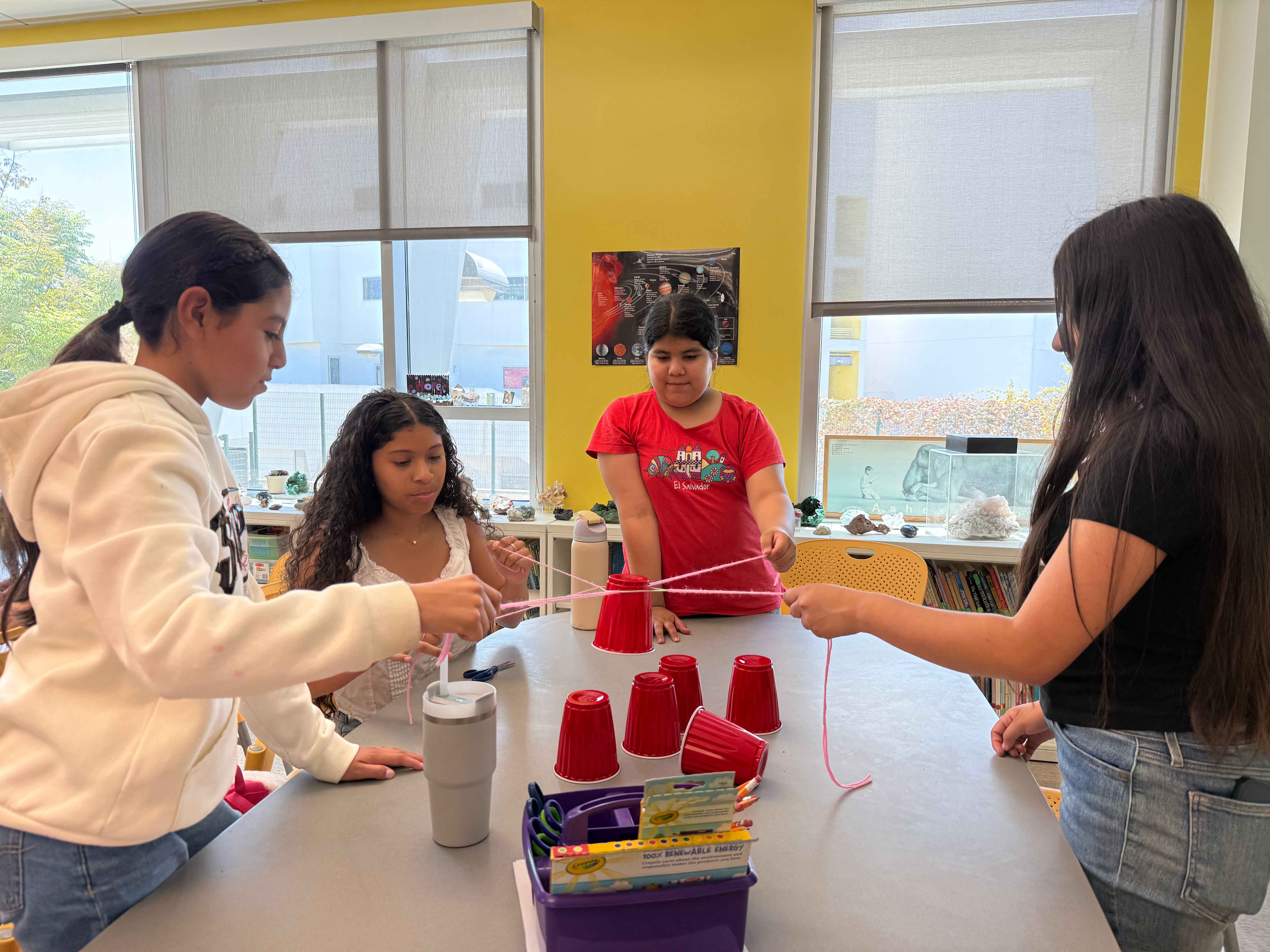 Students participating in the marshmallow tower challenge